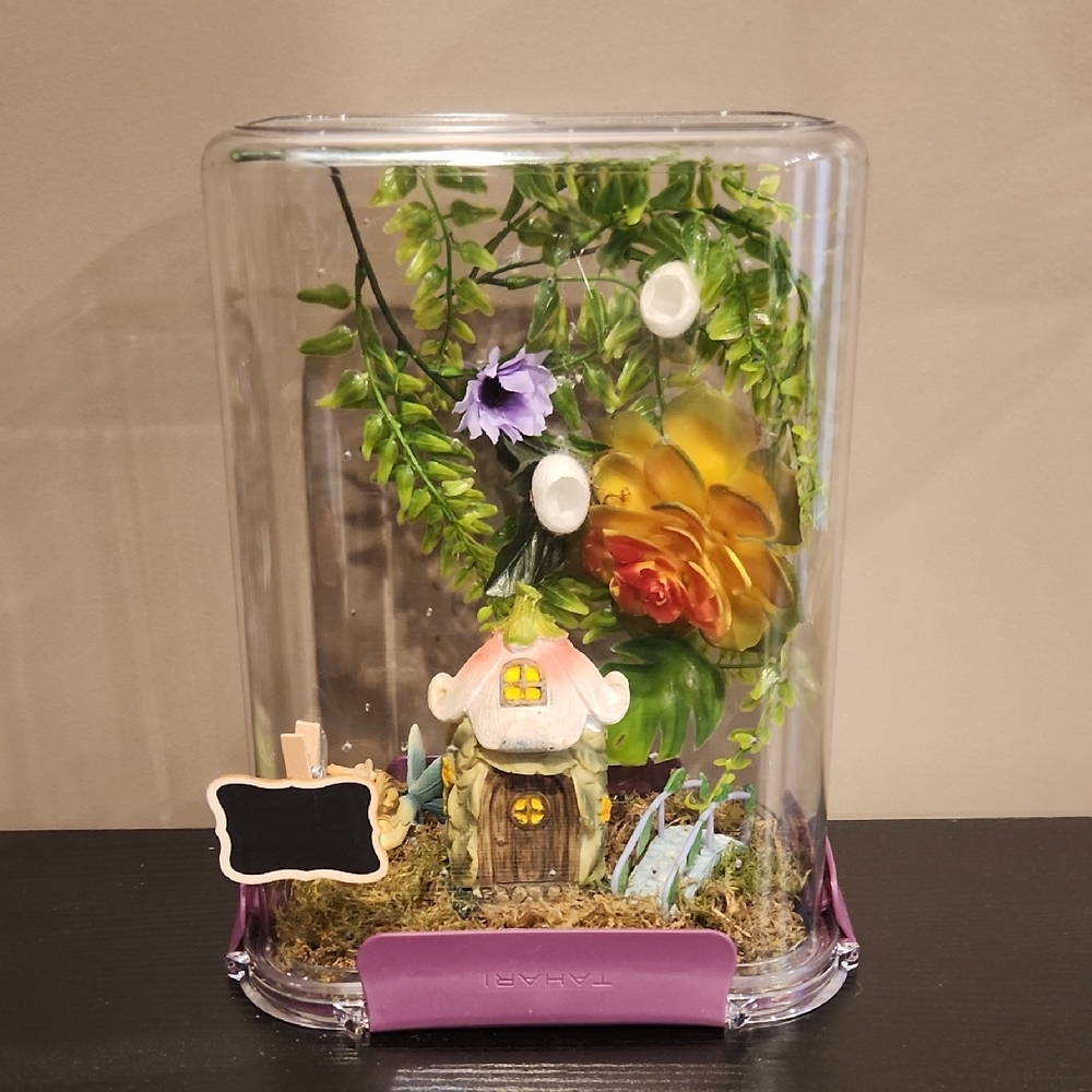 Decorative Terrarium with Flowers and Fairy House